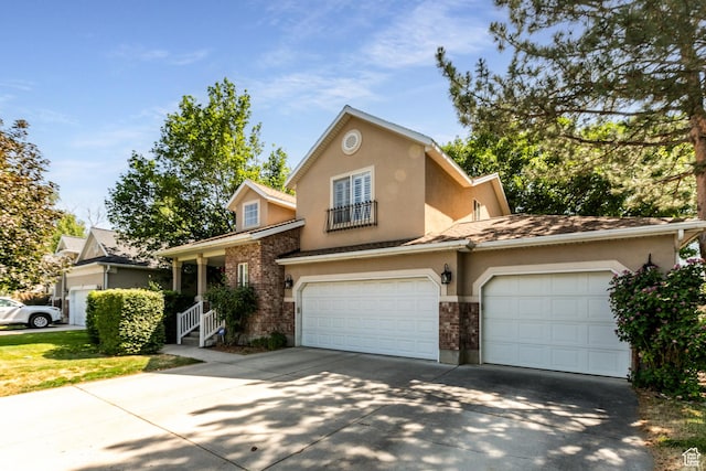 11805 S Sunset Ponds Dr Unit 5, Draper, UT 84020 - traditional home featuring driveway, stucco siding, brick siding, and a garage