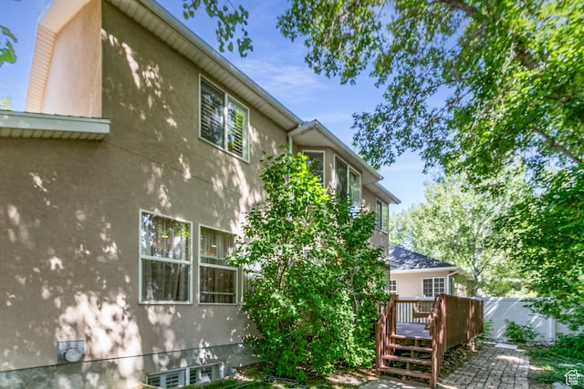 11805 S Sunset Ponds Dr Unit 5, Draper, UT 84020 - view of home's exterior featuring stucco siding and a deck