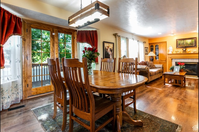11805 S Sunset Ponds Dr Unit 5, Draper, UT 84020 - dining area featuring wood finished floors and a tile fireplace