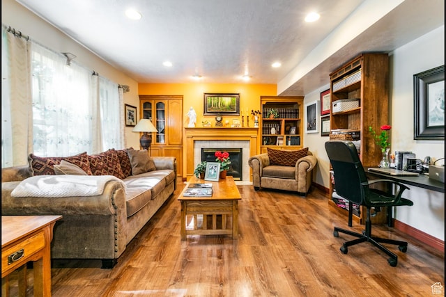 11805 S Sunset Ponds Dr Unit 5, Draper, UT 84020 - living area with a tiled fireplace, wood finished floors, recessed lighting, and an office area