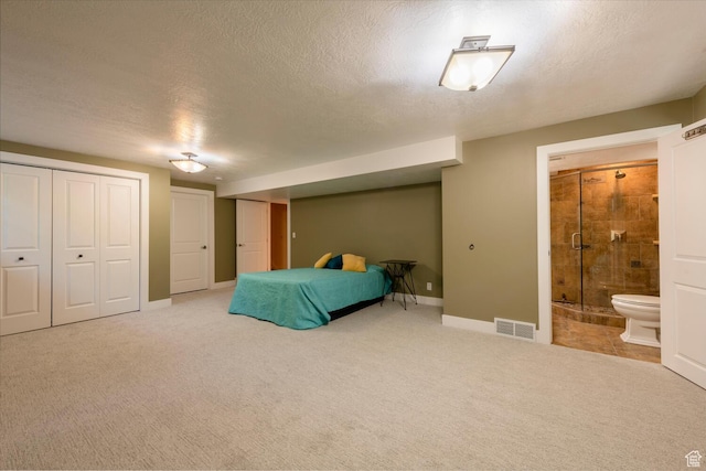 1983 E 1700 S, Salt Lake City, UT 84108 - carpeted bedroom featuring two closets, ensuite bath, and a textured ceiling