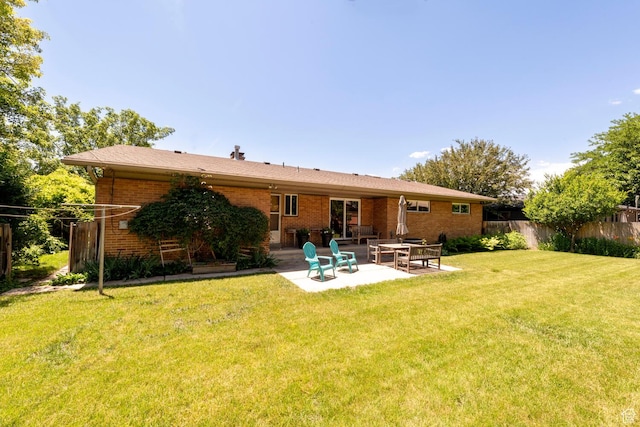 1983 E 1700 S, Salt Lake City, UT 84108 - rear view of house with a patio and brick siding