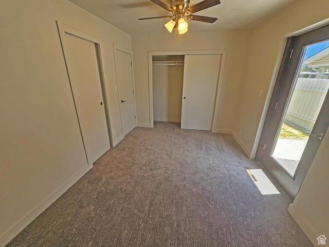 10138 S Peony Way, Sandy, UT 84094 - unfurnished bedroom with carpet, ceiling fan, and multiple closets