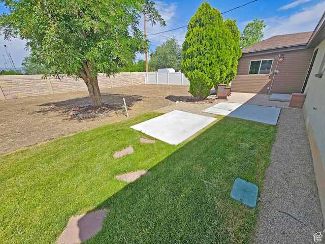 10138 S Peony Way, Sandy, UT 84094 - fenced backyard featuring a patio area