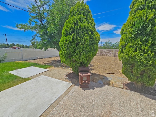 10138 S Peony Way, Sandy, UT 84094 - fenced backyard with a patio
