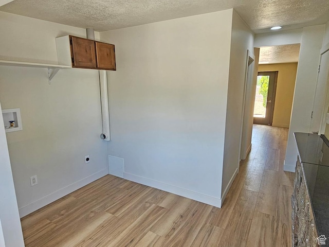 10138 S Peony Way, Sandy, UT 84094 - washroom with hookup for a washing machine, a textured ceiling, light wood finished floors, cabinet space, and hookup for an electric dryer