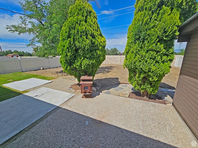 10138 S Peony Way, Sandy, UT 84094 - fenced backyard featuring a patio area