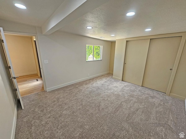 10138 S Peony Way, Sandy, UT 84094 - unfurnished bedroom with light colored carpet, recessed lighting, a textured ceiling, and a closet