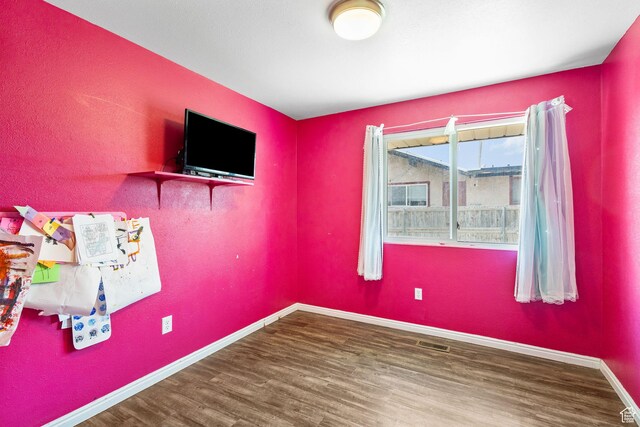 3148 S Old Glory Cir W, Magna, UT 84044 - empty room with wood finished floors and baseboards