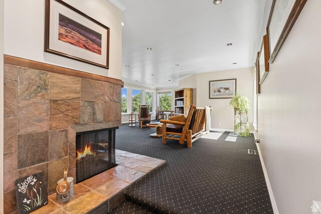 4714 S Idlewild Rd, Millcreek, UT 84124 - carpeted living room featuring a tile fireplace and recessed lighting