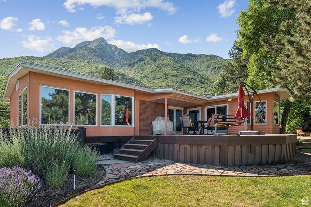 4714 S Idlewild Rd, Millcreek, UT 84124 - back of property with a deck with mountain view