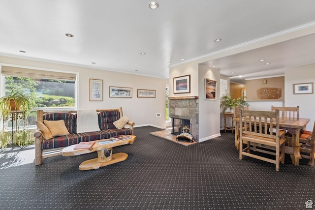 4714 S Idlewild Rd, Millcreek, UT 84124 - living area featuring carpet flooring, ornamental molding, a tiled fireplace, and recessed lighting