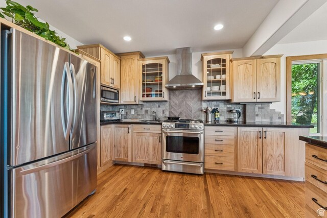 4714 S Idlewild Rd, Millcreek, UT 84124 - kitchen featuring stainless steel appliances, wall chimney exhaust hood, light brown cabinets, and recessed lighting