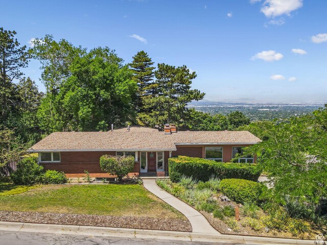 4714 S Idlewild Rd, Millcreek, UT 84124 - ranch-style house featuring a front yard and a chimney