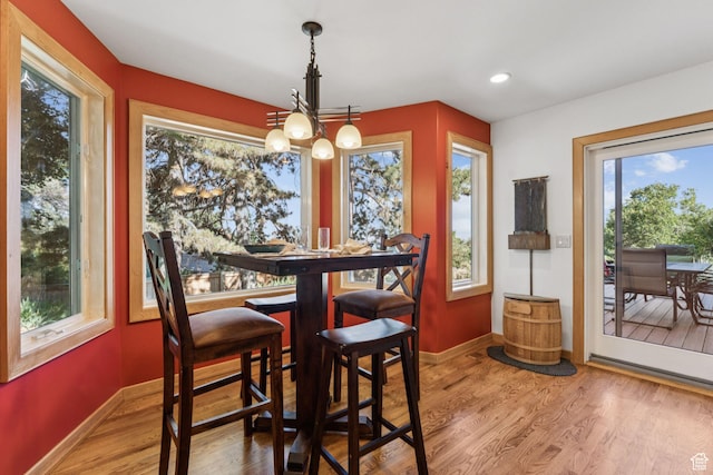 4714 S Idlewild Rd, Millcreek, UT 84124 - dining room featuring wood finished floors, a chandelier, and recessed lighting