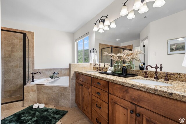15337 S Eagle Crest Dr E, Draper, UT 84020 - bathroom featuring double vanity, a shower stall, a garden tub, tile patterned floors, and a chandelier