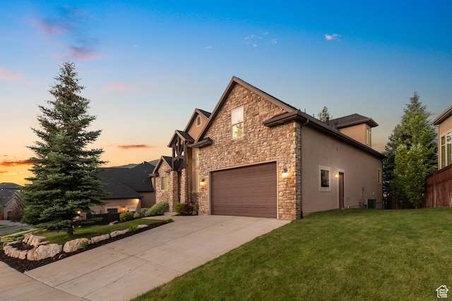 15337 S Eagle Crest Dr E, Draper, UT 84020 - view of front of home featuring stone siding, concrete driveway, and stucco siding