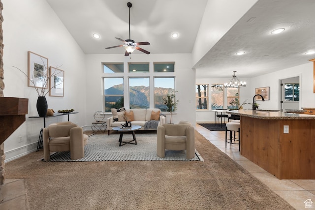 15337 S Eagle Crest Dr E, Draper, UT 84020 - living room featuring a chandelier, ceiling fan, recessed lighting, light tile patterned flooring, and vaulted ceiling