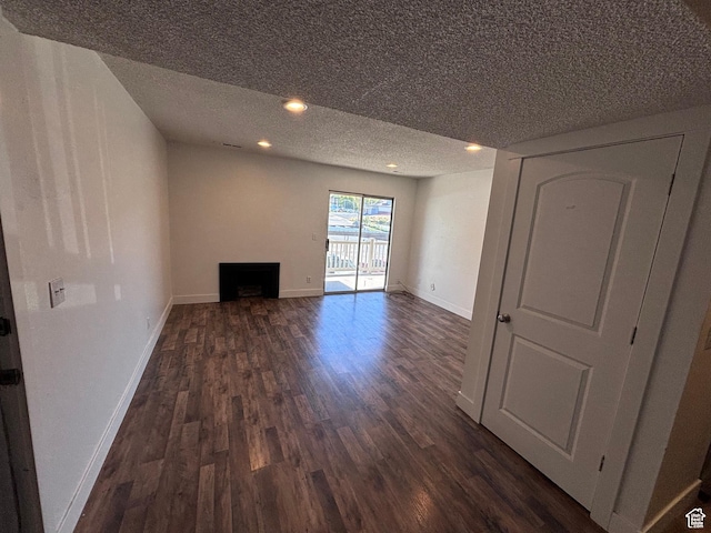 88 W 50 S Unit Q6, Centerville, UT 84014 - unfurnished living room featuring dark wood finished floors, a textured ceiling, a fireplace, and recessed lighting
