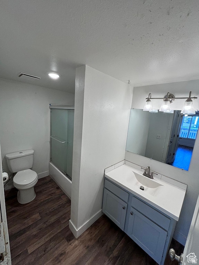 88 W 50 S Unit Q6, Centerville, UT 84014 - bathroom featuring wood finished floors, vanity, combined bath / shower with glass door, and a textured ceiling