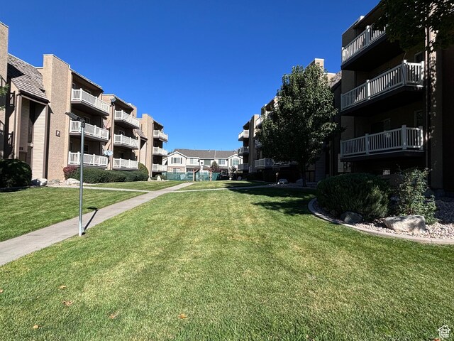 88 W 50 S Unit Q6, Centerville, UT 84014 - view of property's community with a lawn