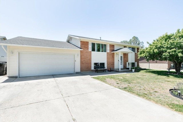623 W 1635 N, Clinton, UT 84015 - raised ranch featuring concrete driveway, a garage, a front yard, and brick siding