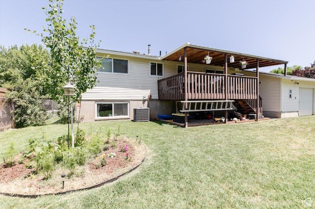 623 W 1635 N, Clinton, UT 84015 - rear view of house with stairs, a lawn, a wooden deck, and an attached garage
