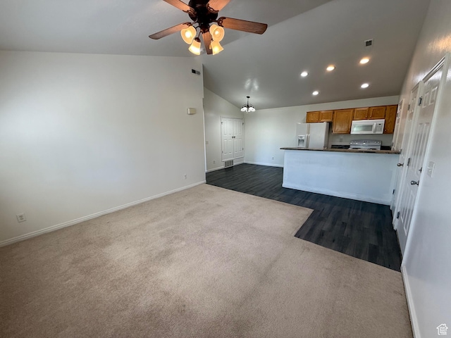 1779 W 1200 S Unit 319, Springville, UT 84663 - kitchen with white appliances, dark countertops, vaulted ceiling, dark colored carpet, and a ceiling fan