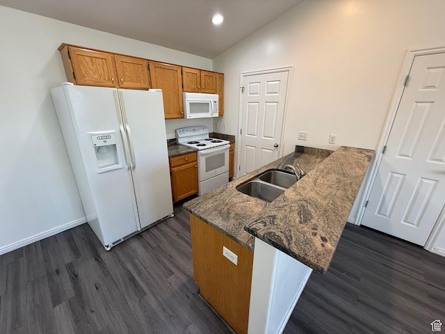 1779 W 1200 S Unit 319, Springville, UT 84663 - kitchen with white appliances, lofted ceiling, dark wood finished floors, a peninsula, and brown cabinets