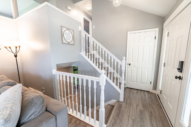 2466 N 1050 W, Clinton, UT 84015 - foyer with wood finished floors, lofted ceiling, and stairs
