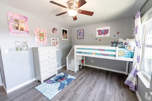 2466 N 1050 W, Clinton, UT 84015 - bedroom featuring multiple windows, wood finished floors, and ceiling fan