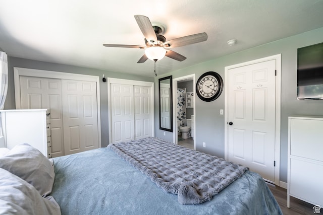 2466 N 1050 W, Clinton, UT 84015 - bedroom with two closets, a ceiling fan, and dark wood-style flooring