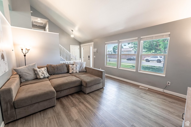 2466 N 1050 W, Clinton, UT 84015 - living area with stairs, wood finished floors, and high vaulted ceiling
