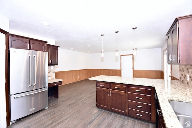 686 E 400 N, Lehi, UT 84043 - kitchen with high quality fridge, wainscoting, a peninsula, light stone countertops, and light wood-type flooring