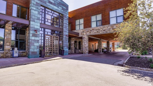 1456 W Newpark Blvd Unit 213, Park City, UT 84098 - view of property featuring a carport and driveway