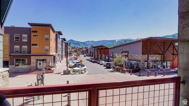 1456 W Newpark Blvd Unit 213, Park City, UT 84098 - view of road featuring a mountain view, sidewalks, and curbs