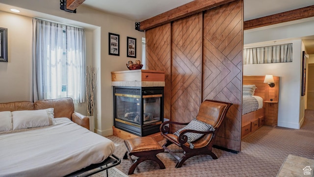 1456 W Newpark Blvd Unit 213, Park City, UT 84098 - bedroom featuring beamed ceiling, a tile fireplace, carpet flooring, and recessed lighting