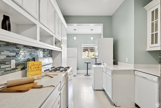 310 S 300 E Unit A2, Salt Lake City, UT 84111 - kitchen featuring white appliances, decorative backsplash, white cabinetry, open shelves, and glass insert cabinets