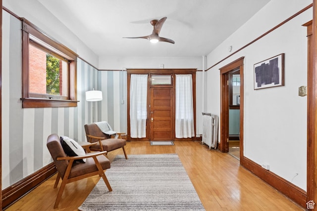 310 S 300 E Unit A2, Salt Lake City, UT 84111 - sitting room with radiator heating unit, light wood-style floors, and a ceiling fan