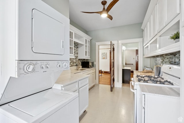 310 S 300 E Unit A2, Salt Lake City, UT 84111 - laundry area with stacked washer / dryer and ceiling fan