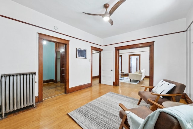 310 S 300 E Unit A2, Salt Lake City, UT 84111 - living area featuring radiator, ceiling fan, and light wood-style floors
