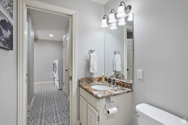 1964 N 2000 E, Layton, UT 84040 - bathroom featuring vanity, washer and clothes dryer, and tile patterned floors