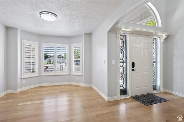 1964 N 2000 E, Layton, UT 84040 - foyer with plenty of natural light, wood finished floors, and a textured ceiling