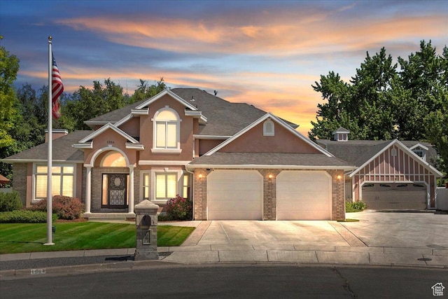 1964 N 2000 E, Layton, UT 84040 - traditional-style home featuring a garage, driveway, stucco siding, and brick siding