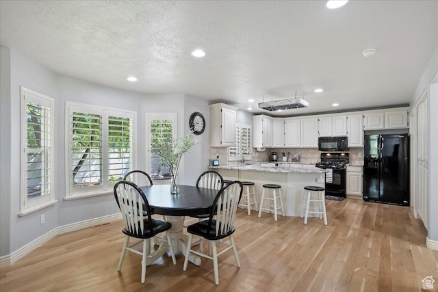 1964 N 2000 E, Layton, UT 84040 - dining area with light wood-style flooring, healthy amount of natural light, recessed lighting, and a textured ceiling