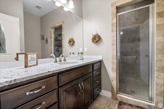 216 E 1370 S, Nephi, UT 84648 - bathroom with vanity, a stall shower, and tile patterned flooring