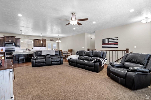216 E 1370 S, Nephi, UT 84648 - carpeted living room with ceiling fan, a textured ceiling, recessed lighting, and a chandelier
