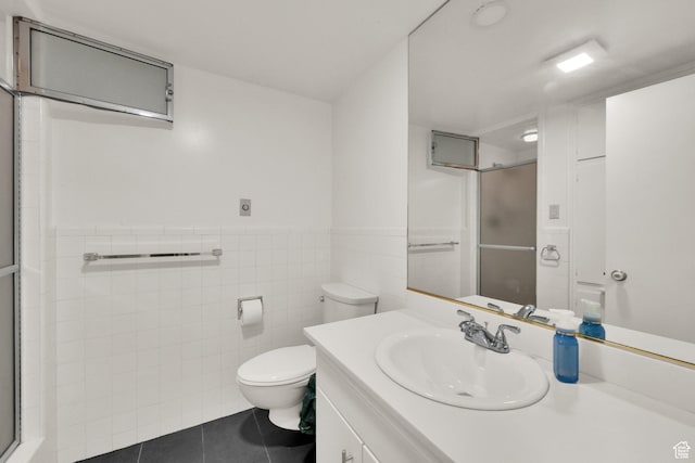 515 S 1000 E Unit 706, Salt Lake City, UT 84102 - full bathroom with tile patterned flooring, vanity, a stall shower, wainscoting, and tile walls