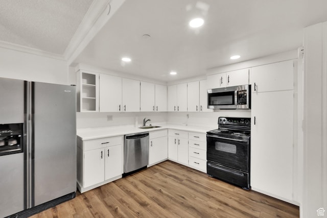 515 S 1000 E Unit 706, Salt Lake City, UT 84102 - kitchen featuring stainless steel appliances, light countertops, ornamental molding, white cabinetry, and recessed lighting