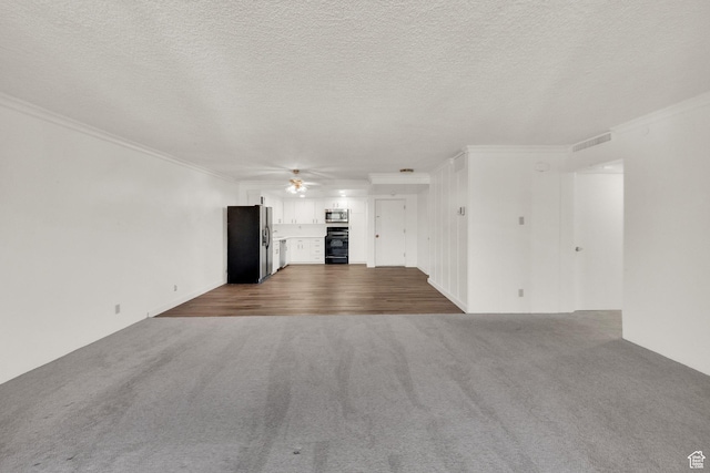 515 S 1000 E Unit 706, Salt Lake City, UT 84102 - unfurnished living room featuring dark carpet, ceiling fan, ornamental molding, and a textured ceiling